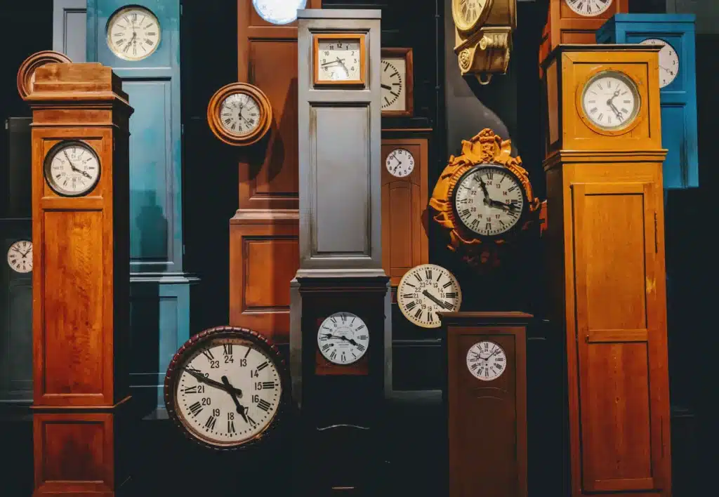 Multiple grandfather clocks. Meant to illustrate the pressure of university applications and high school deadlines. 